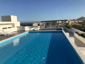 Moderno condo de 1 rec con alberca 5 mins a playa